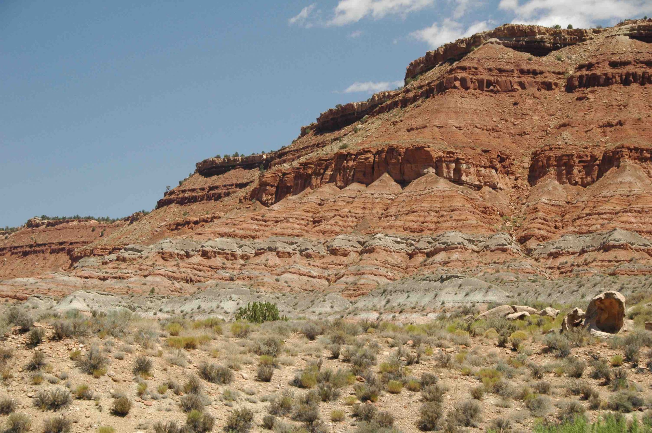 Outcrop of sedimentary rocks that shows the principles of superposition and original horizontality.