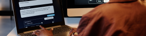 A person on the computer.