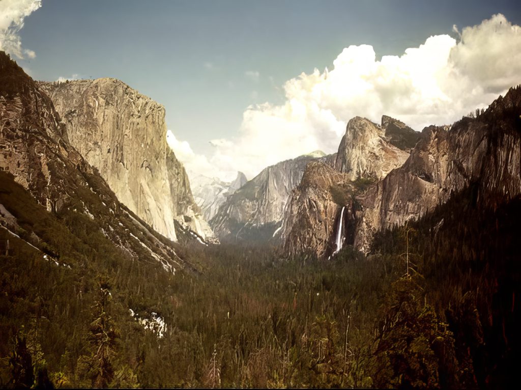 View down into a valley at sunset.