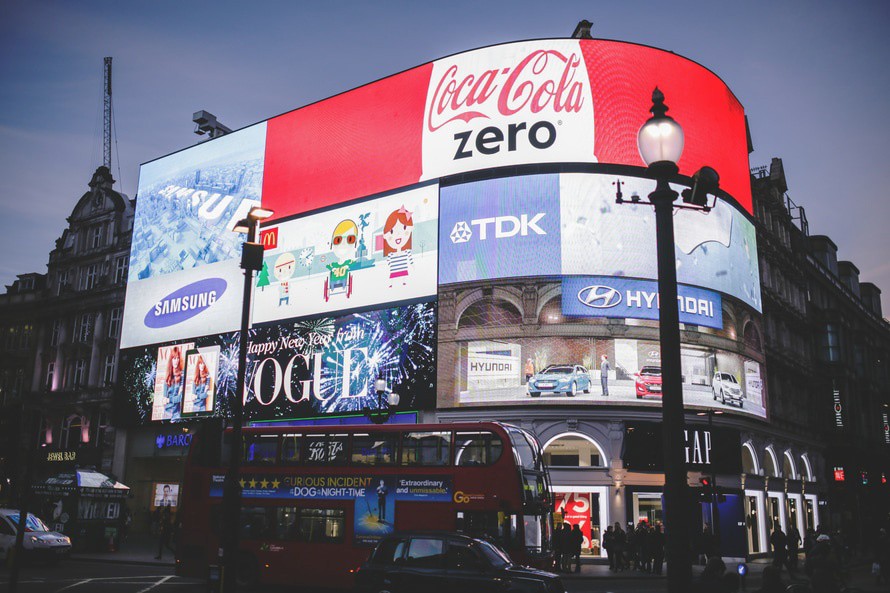 Picadilly Circus. A corner building with bright LCD billboard covering the street facing side