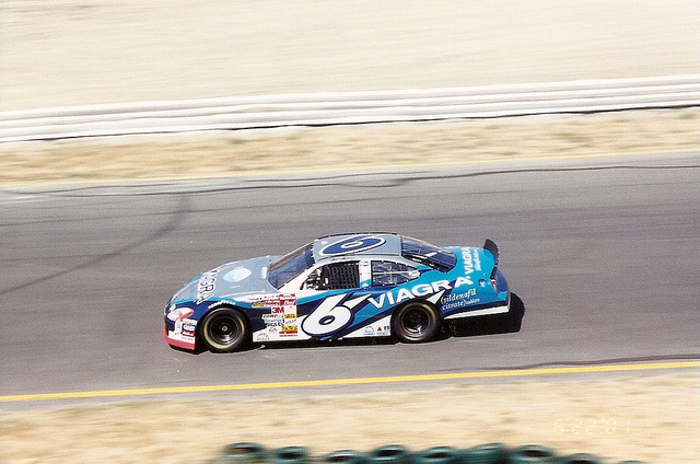 A nascar racing car with multiple branded decals.